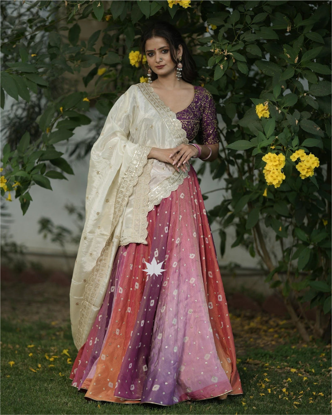 Multicolour Bandhani Chaniya With Purple Silk Blouse And Off White Dupatta Set