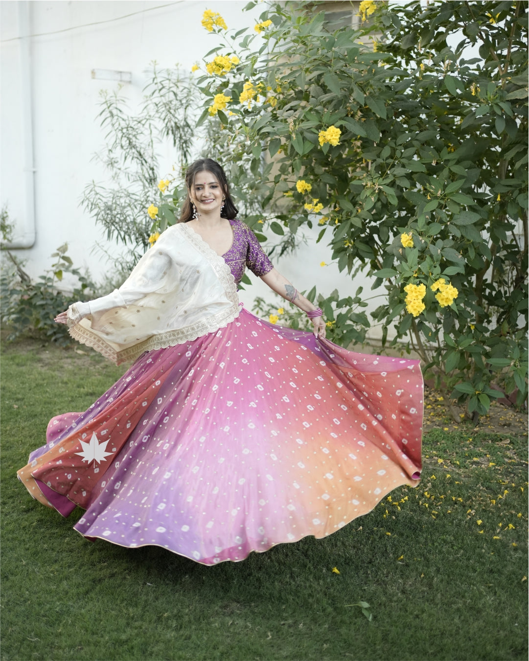 Multicolour Bandhani Chaniya With Purple Silk Blouse And Off White Dupatta Set