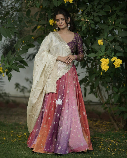 Multicolour  Bandhani Chaniya With Purple Silk Blouse And Off White Dupatta Set