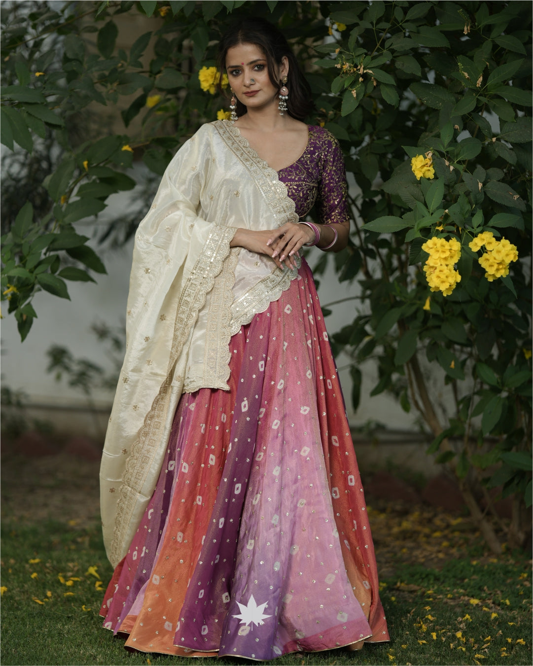 Multicolour  Bandhani Chaniya With Purple Silk Blouse And Off White Dupatta Set