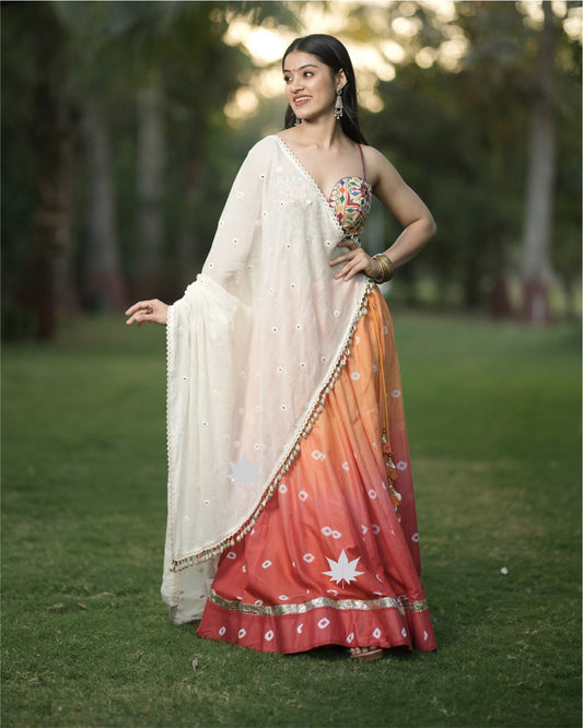 Orange Bandhani Chaniya With Gamthi Work Blouse And White Dupatta