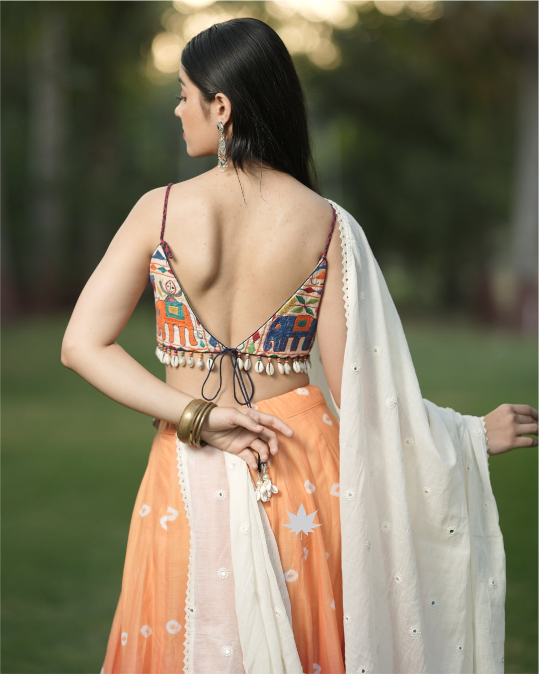 Orange Bandhani Chaniya With Gamthi Work Blouse And White Dupatta